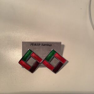 A pair of silver and enamel pierced earrings